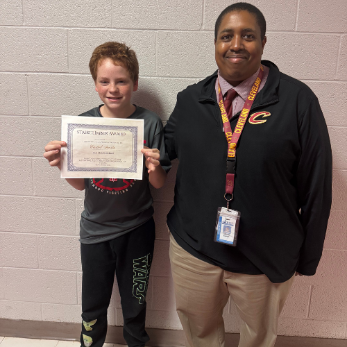 Castiel Acosta, East's Stairclimber for November, poses with his award plaque.